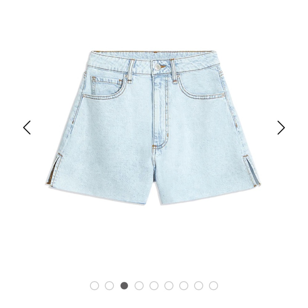 WeWoreWhat light wash flair denim shorts.